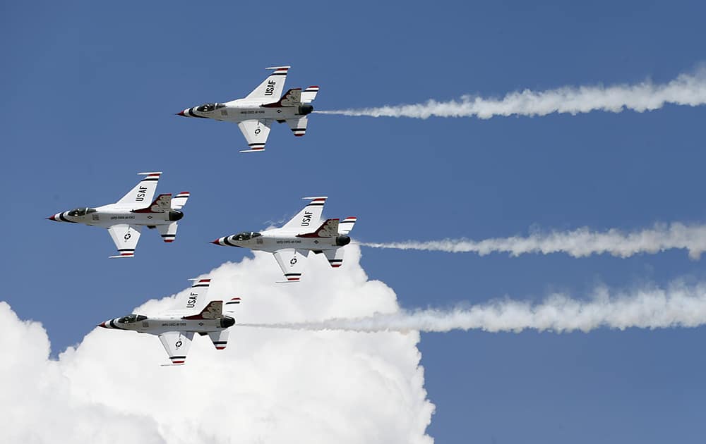 F-16 jets from the Thunderbirds perform after the completion of the graduation ceremony for the Air Force class of 2014, at the U.S. Air Force Academy, Colo.