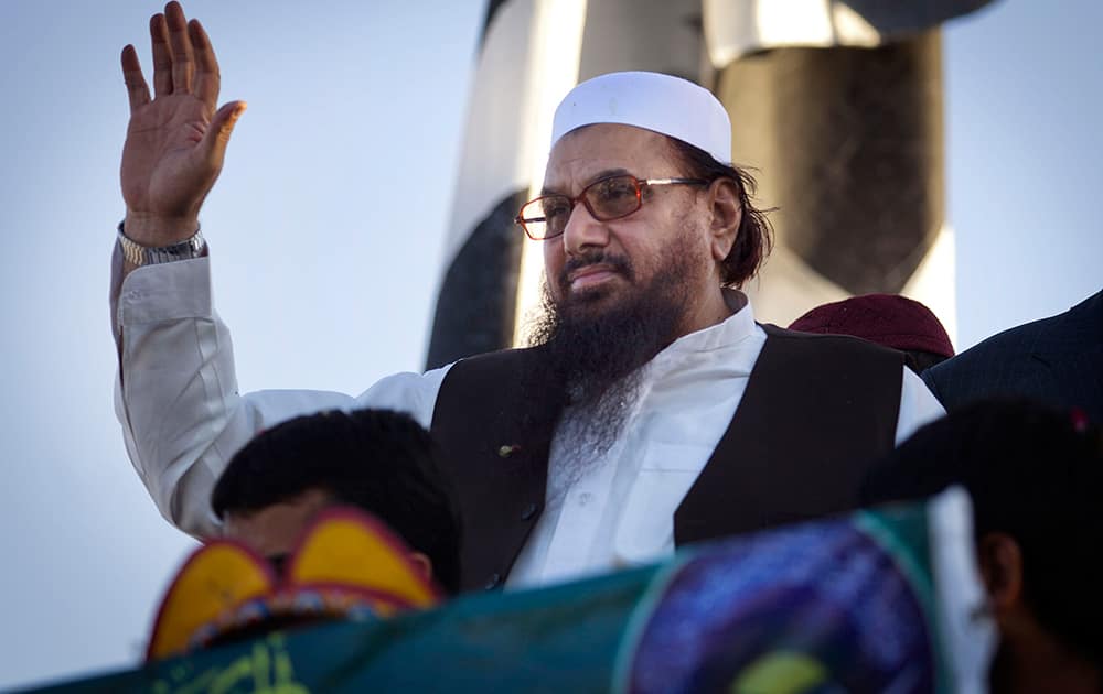 Hafiz Saeed, leader of Pakistani religious party Jamaatud Dawa, waves to his supporters celebrating the 16th anniversary of the nuclear test, in Islamabad.