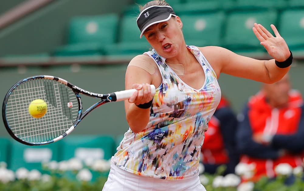 Russia`s Alisa Kleybanova returns the ball to Romania`s Simona Halep in the first round match of the French Open tennis tournament at the Roland Garros stadium, in Paris, France.