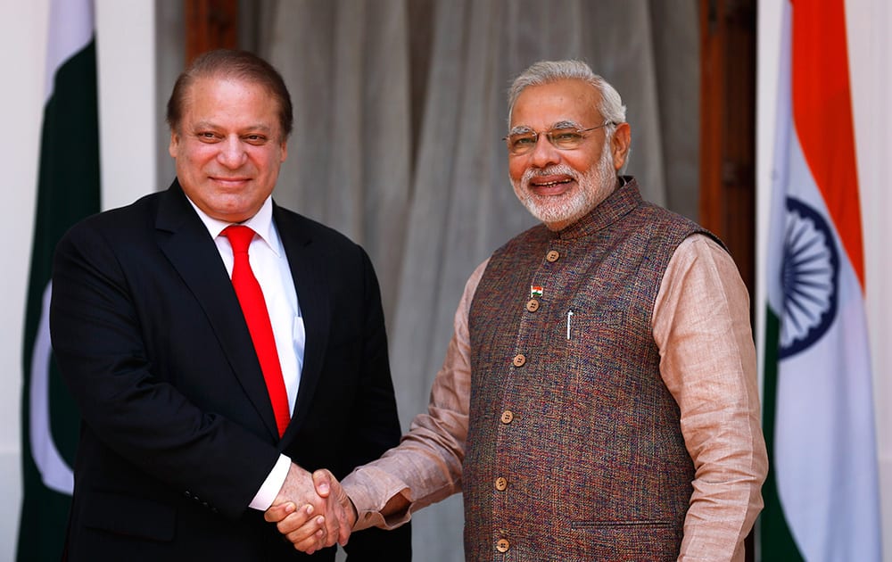 Prime Minister Narendra Modi shakes hand with his Pakistani counterpart Nawaz Sharif before the start of their meeting in New Delhi.