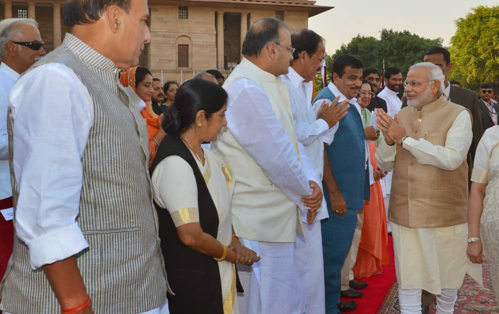 In this photo released by the Indian President’s office, India`s new Prime Minister-elect Narendra Modi, second right, greets other leaders upon arrival for his inauguration in New Delhi, India.