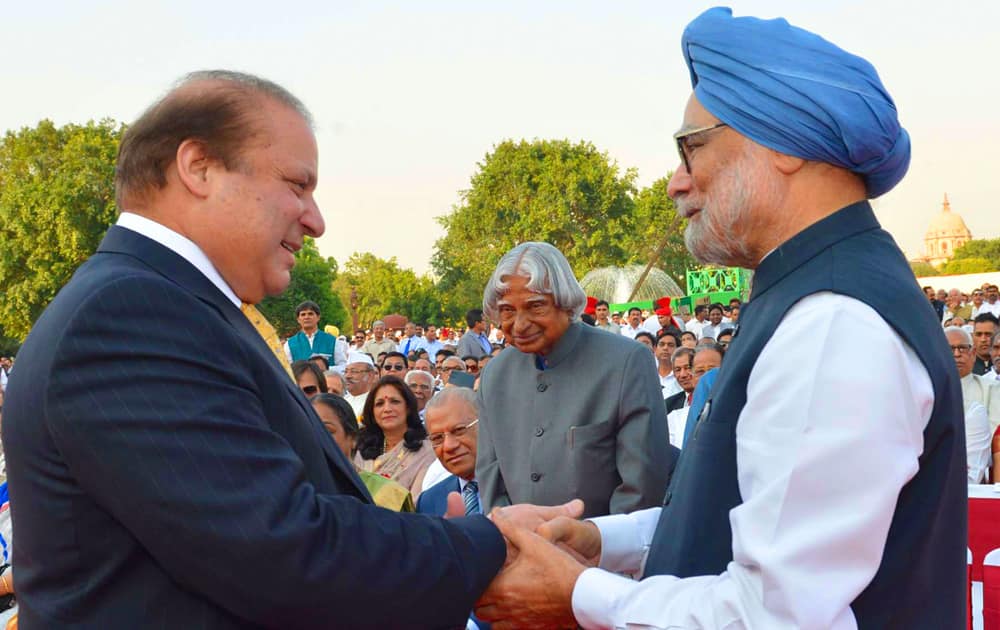 In this photo released by the Indian President`s office, India`s outgoing Prime Minister Manmohan Singh, right, greets Pakistani Prime Minister Nawaz Sharif, left, as former Indian president A P J Abdul Kalam, center, watches during the inauguration of new prime minister Narendra Modi in New Delhi, India.