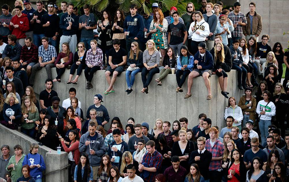 Students gather for a candlelight vigil to honor the victims of Friday night`s mass shooting on the campus of the University of California, Santa Barbara.