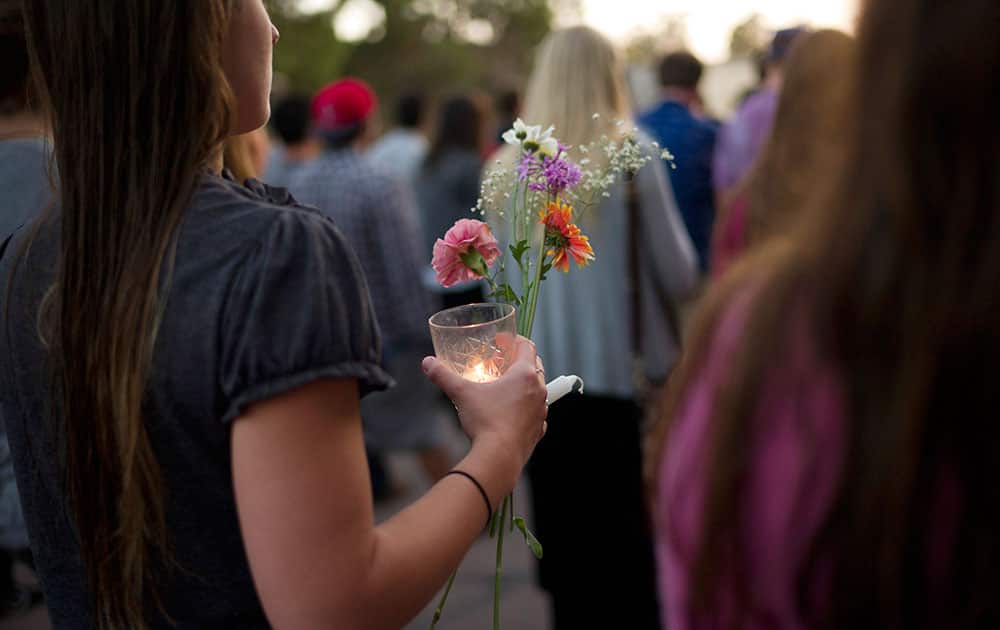 People march on the campus of the University of California, Santa Barbara during a candlelight vigil held to honor the victims of Friday night`s mass shooting.