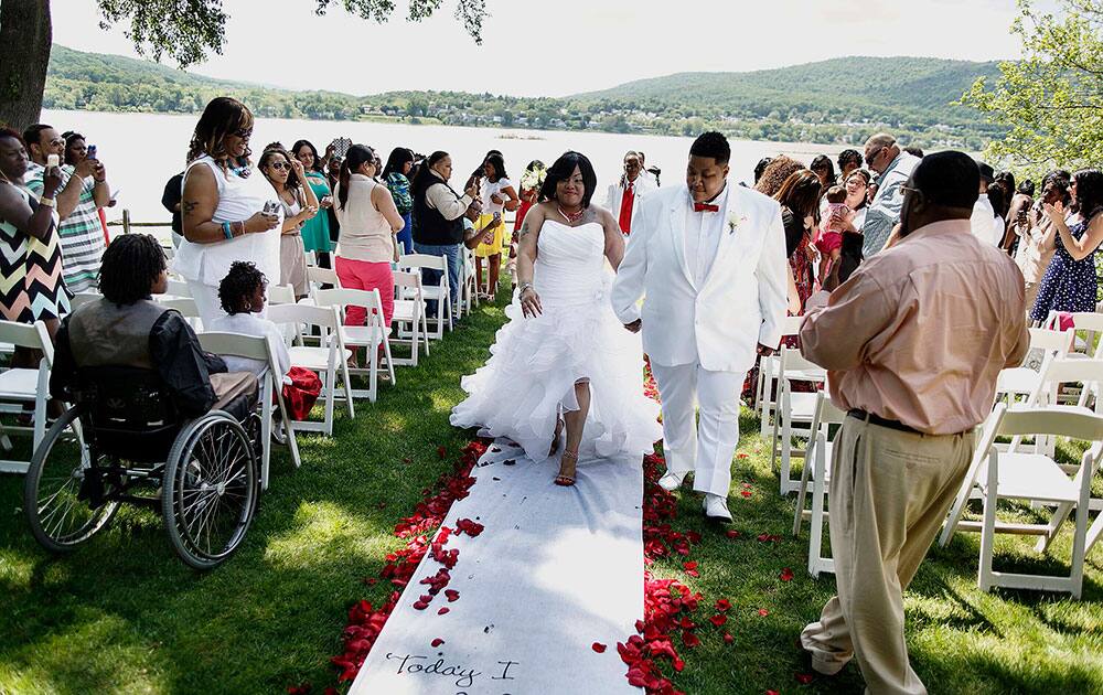 Days after the legalization of gay marriage in Pennsylvania, LaQuana Myrick, left, and Stephanie Stewart of Harrisburg get married at Fort Hunter Park Mansion in Harrisburg, Pa.