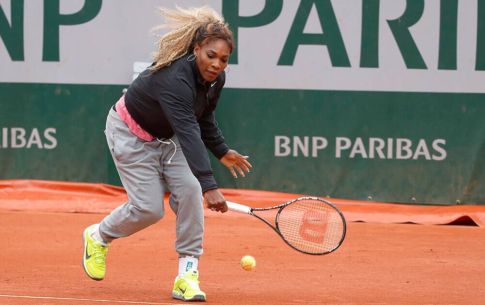 Serena Williams of the US, returns the ball during a training session for the French Open tennis tournament, at the Roland Garros stadium in Paris.