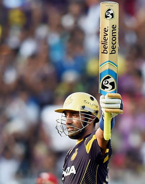 KKR batsman Robin Uthappa celebrates his fifty runs during their IPL match against RCB at Eden Garden in Kolkata.