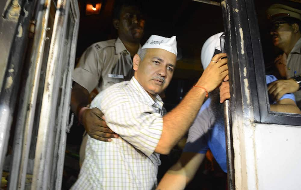 Police detain Aam Aadmi Party leaderManish Sisodia who along with others was protesting outside Tihar Prisons over the arrest of party chief Arvind Kejriwal in New Delhi.