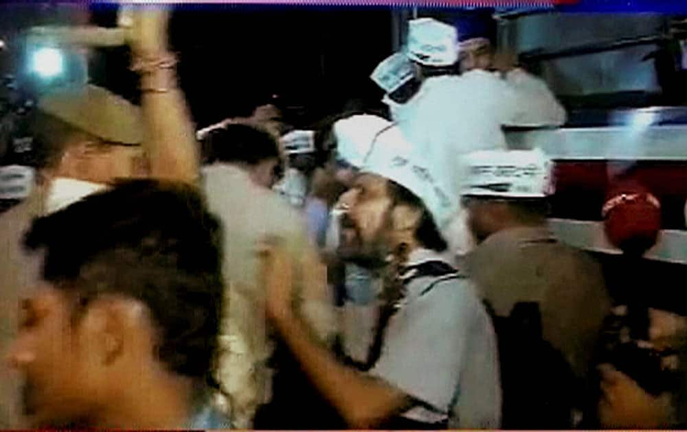 Police in action against AAP supporters who were protesting outside Tihar Prisons over the arrest of party chief Arvind Kejriwal in New Delhi.