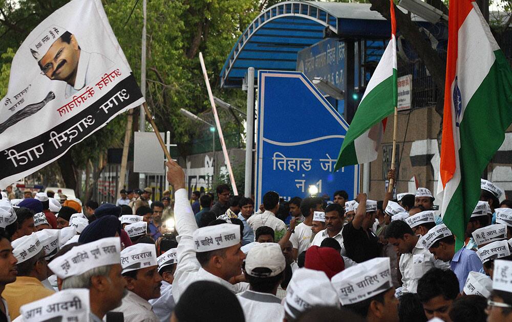 AAP supporters protest outside Tihar Prisons over the arrest of party chief Arvind Kejriwal in New Delhi.