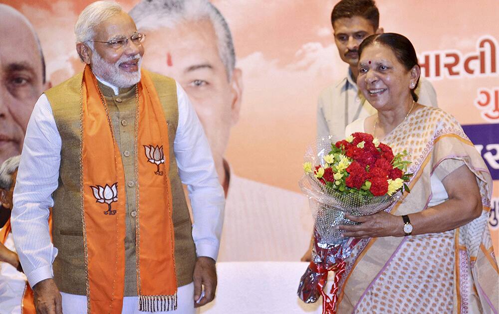 Prime Minister-elect Narendra Modi greets Anandiben Patel after she was elected as the leader of BJP legislative party in Gandhinagar on Wednesday. Anandiben will be the first woman Chief Minister of Gujarat.