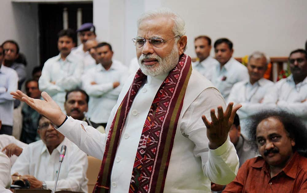 Prime Minister-elect and Gujarat Chief Minister Narendra Modi addresses a special session of the state Assembly in Gandhinagar on Wednesday. The special session of the Assembly was called to bid farewell to Modi.