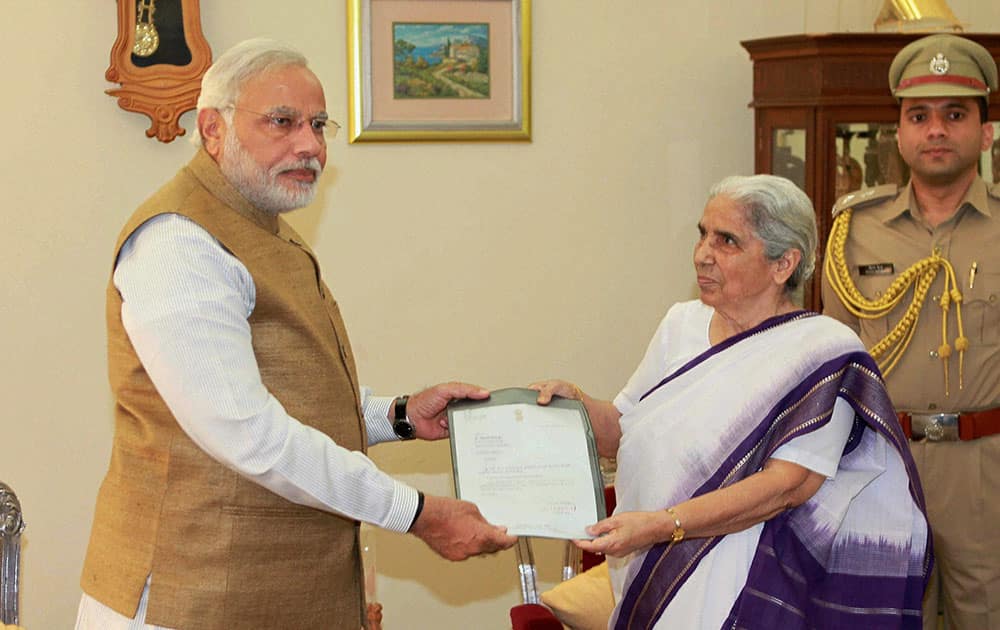 Prime Minister-elect and outgoing Chief Minister Narendra Modi submits his resignation letter to Gujarat Governor Kamla Beniwal in Gandhinagar.