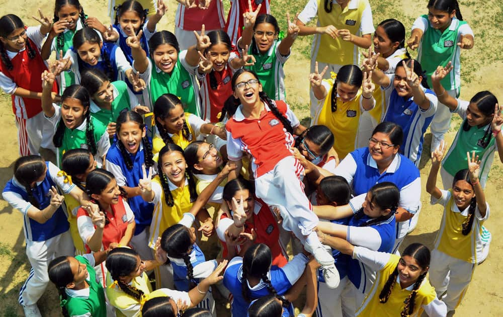 Students of a school in a jubilant mood after the declaration of CBSE class X results in Patiala.