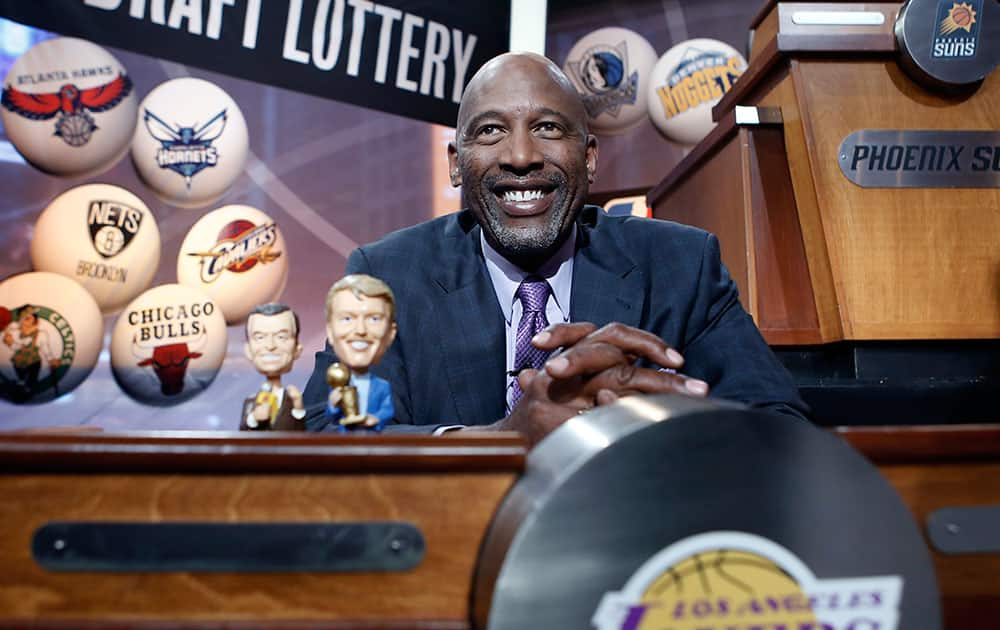 Basketball Hall of Famer James Worthy smiles before the start of the NBA basketbal draft lottery in New York.