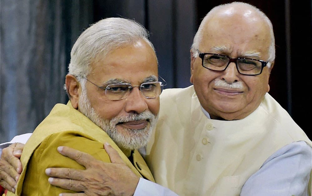 Narendra Modi hugs party leader Lal Krishna Advani during the BJP parliamentary party meeting in New Delhi.