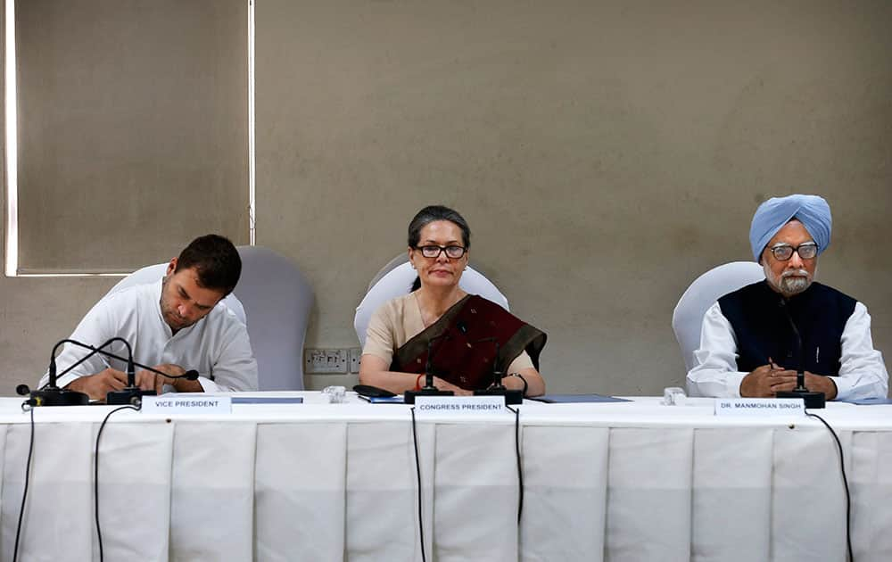 India’s outgoing prime minister Manmohan Singh, right, Congress party president Sonia Gandhi, center, and party vice president Rahul Gandhi, attend a meeting of the Congress Working Committee to review the party’s defeat in the general elections in New Delhi.