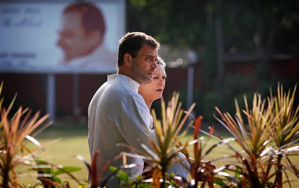 Congress party president Sonia Gandhi, behind, and her son and party vice president Rahul Gandhi, arrive to attend a meeting of the Congress Working Committee to review the party’s defeat in the general elections in New Delhi.