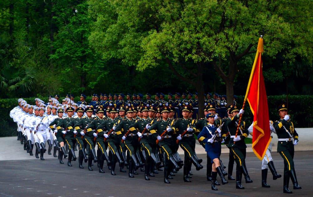 Members of a Chinese honor guard prepare for the arrival of President Xi Jinping and Kazakhstan`s President Nursultan Nazarbayev for the welcoming ceremony at the Xijiao State Guesthouse on the eve of the fourth summit of the Conference on Interaction and Confidence Building Measures in Asia (CICA) in Shanghai.