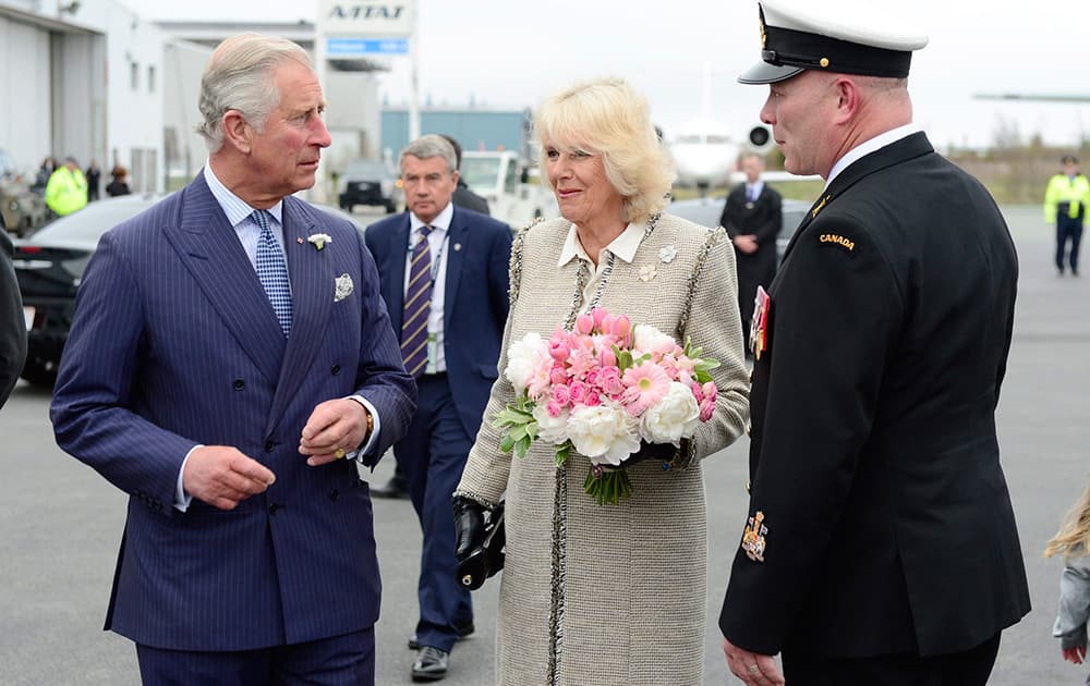 Prince Charles and Camilla the Duchess of Cornwall are greeted by officials in Halifax, as The Royal couple begins a four-day tour of Canada. 