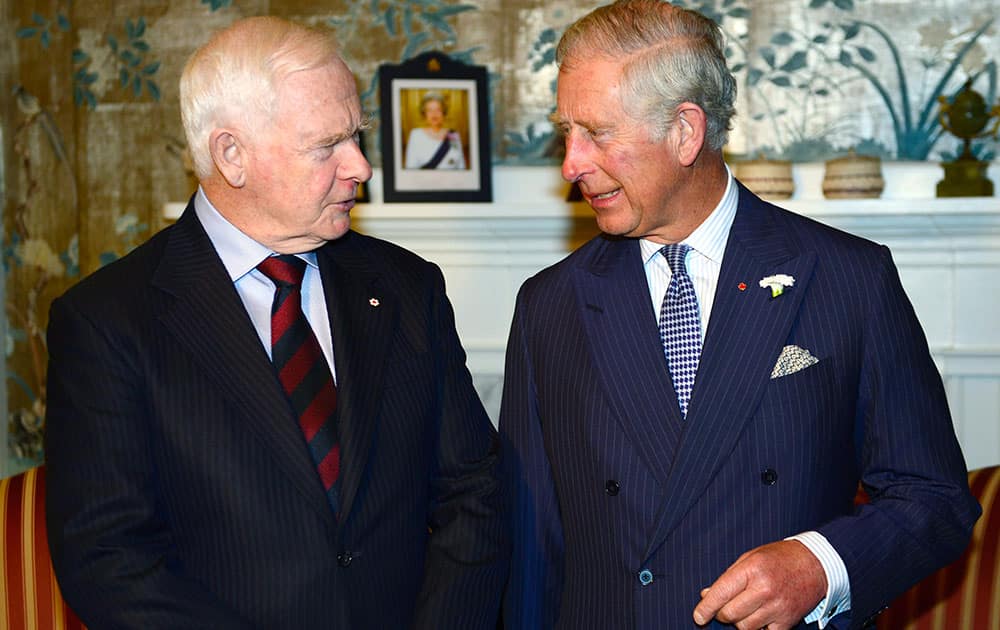 Prince Charles, right, meets the Governor General of Canada David Johnston in Halifax, Canada.