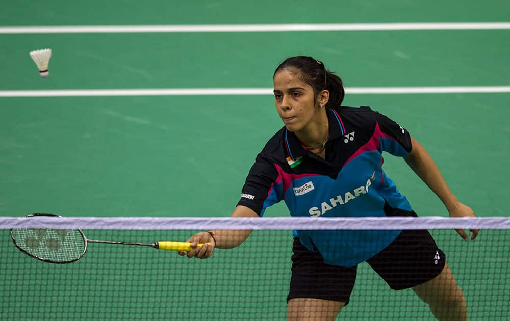 India`s Saina Nehwal returns a shot against Canada`s Joycelyn Ko during their women`s singles event of the Uber Cup Badminton in New Delhi.