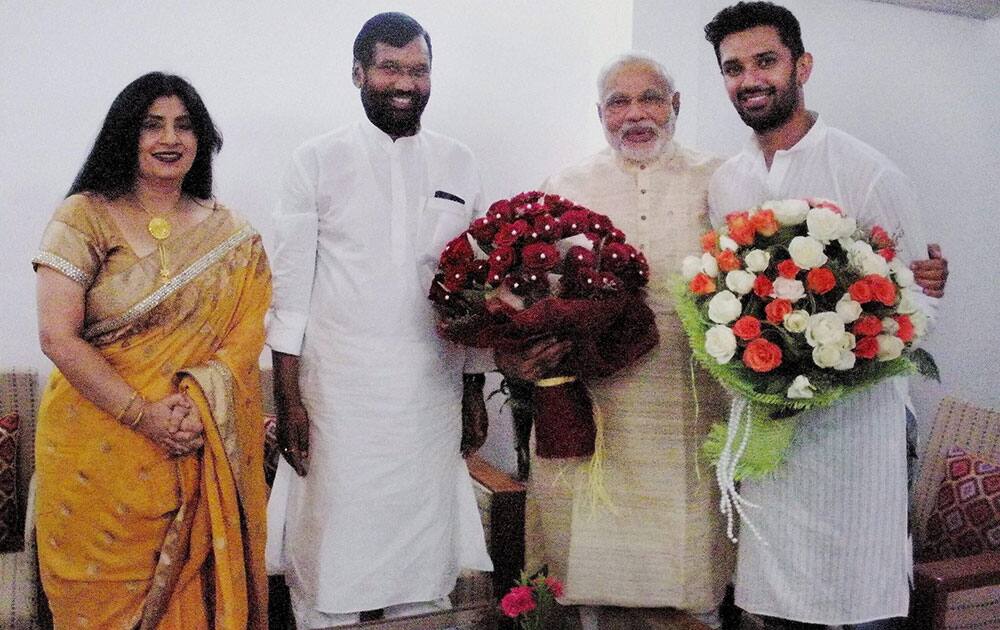 NEXT Prime Minister Narendra Modi poses with Ram Vilas Pawan and his son Chirag Paswan and his wife in New Delhi.