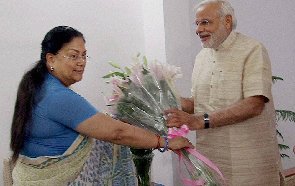 Bharatiya Janata Party leader and the next Prime Minister Narendra Modi is greeted by Rajasthan Chief Minister Vasundhara Raje in New Delhi.