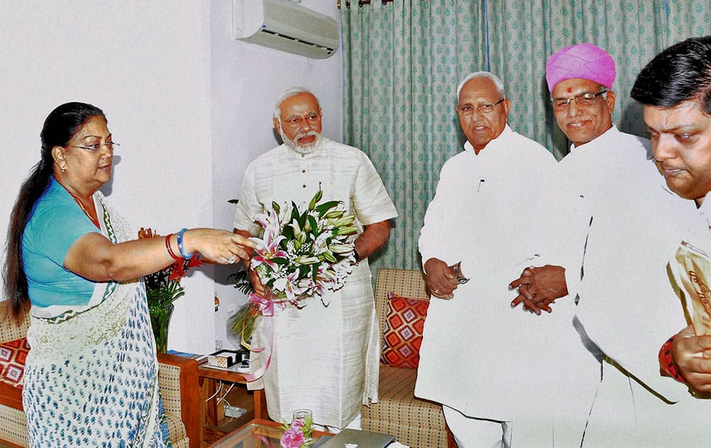 Bharatiya Janata Party leader and the next Prime Minister Narendra Modi is greeted by Rajasthan Chief Minister Vasundhara Raje in New Delhi.