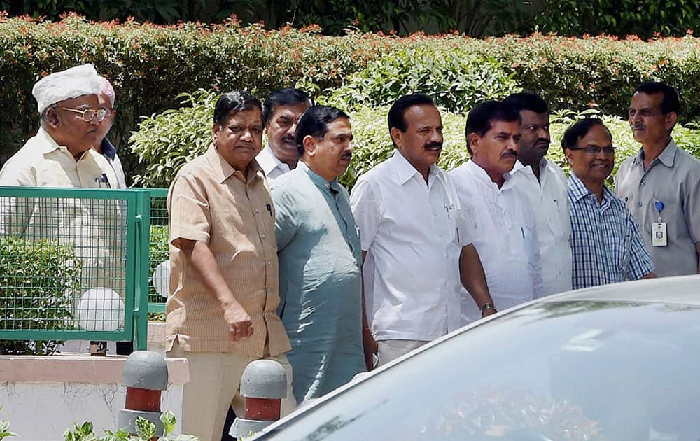 Karnataka BJP Leaders Jagadish Shettar with D V Sadananda Gowda and other coming out after meeting with Bharatiya Janata Party leader and the next Prime Minister Narendra Modi (not in the pic) at Gujarat Bhawan in New Delhi.