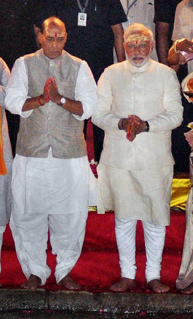 BJP leader and the next Prime Minister Narendra Modi with party President Rajnath Singh performing Ganga Aarti in Varanasi.