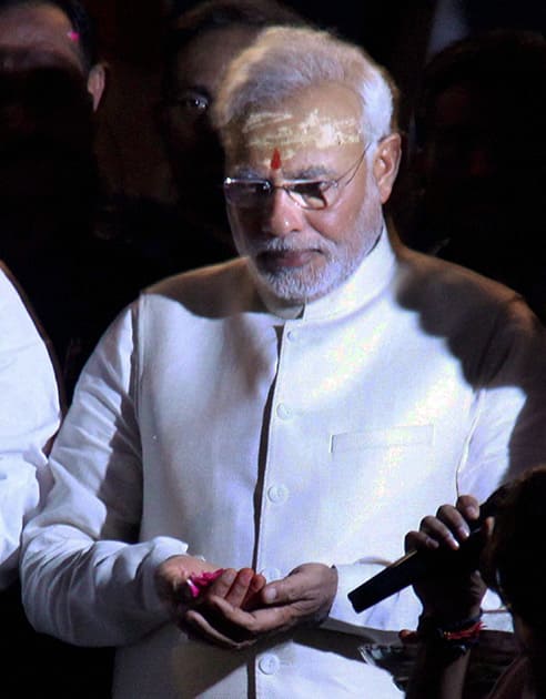 BJP leader and the next Prime Minister Narendra Modi prays to Ganga during the Aarti in Varanasi.