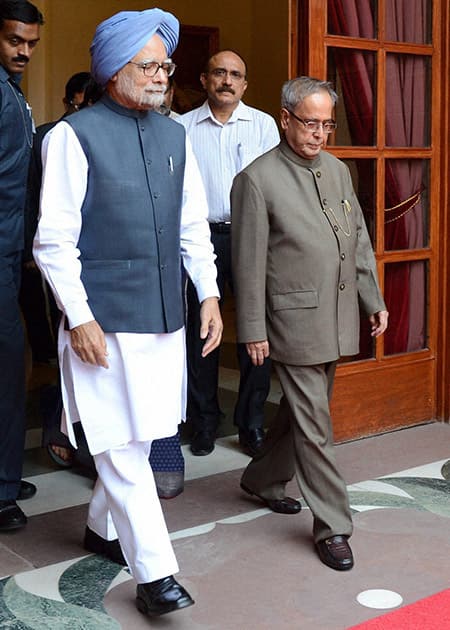 President Pranab Mukherjee with Prime Minister Manmohan Singh who submitted his resignation at Rashtrapati Bhavan in New Delhi.