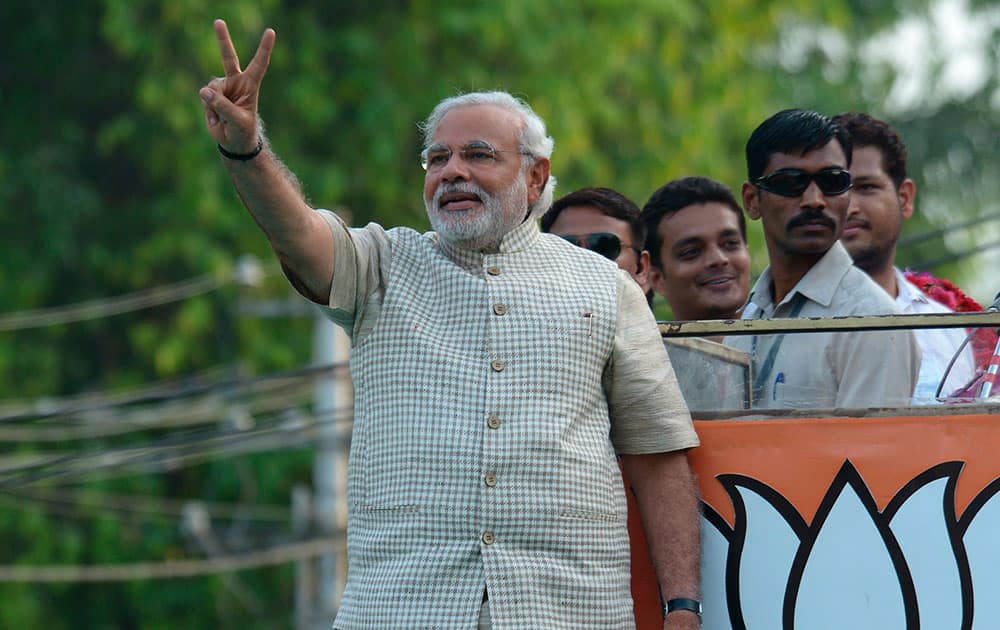 6:10 PM Bharatiya Janata Party (BJP) leader and India`s next prime minister Narendra Modi greets supporters after his landslide victory in Vadodara.