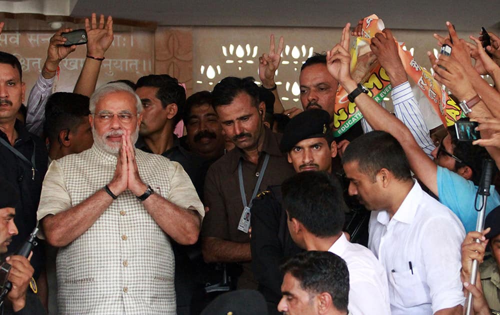 03:00 P.M.- Narendra Modi greets supporters at the party headquarters in Gandhinagar, Gujarat.