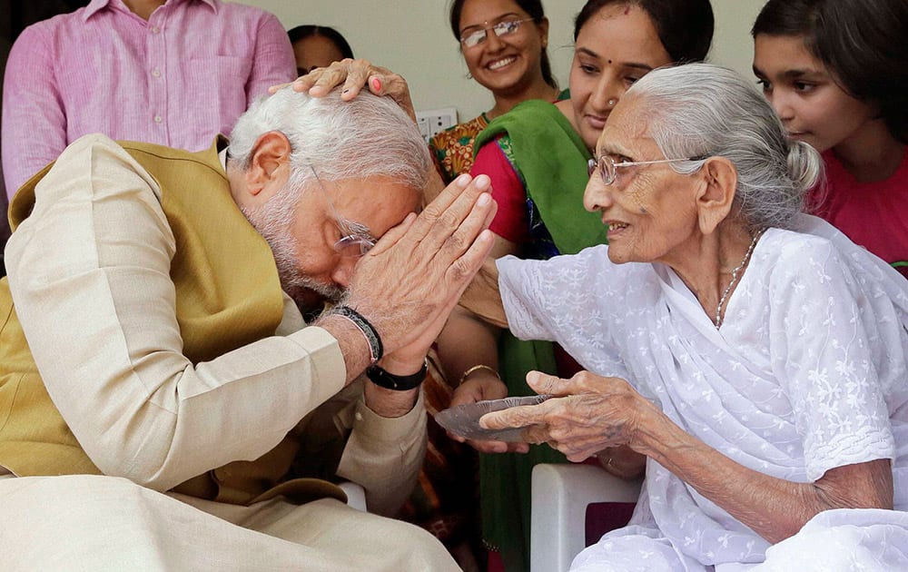 90-year-old Hiraben blesses her son and India`s next prime minister Narendra Modi at her home in Gandhinagar, Gujarat.