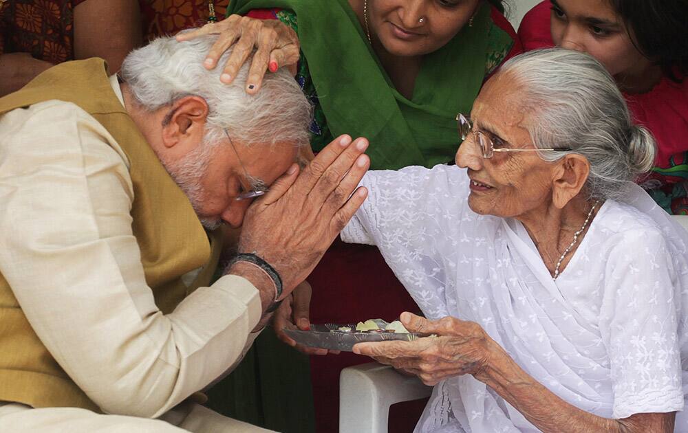 90-year-old Hiraben blesses her son and India`s next prime minister Narendra Modi at her home in Gandhinagar, Gujarat.