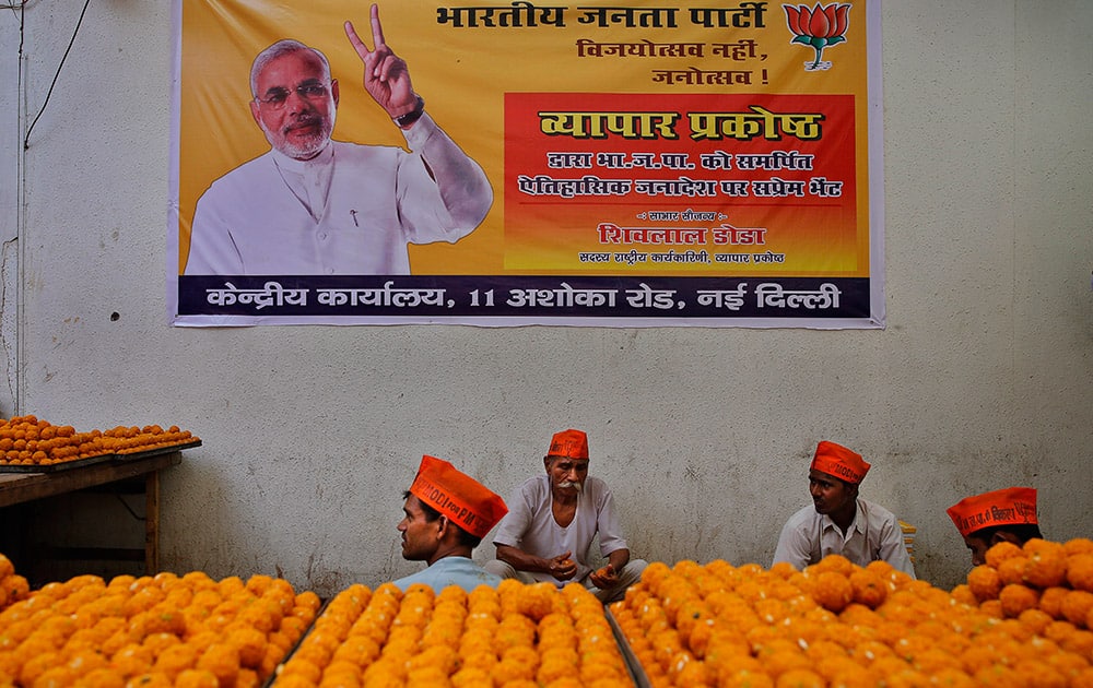 Workers prepare sweets anticipating election victory for the Bharatiya Janata Party (BJP) at the party’s headquarters, in New Delhi.