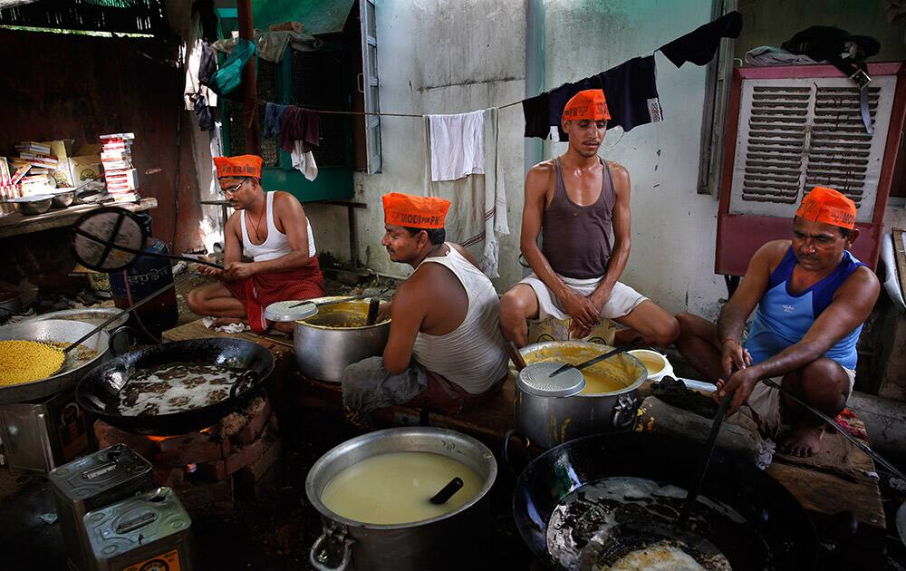 Workers prepare sweets anticipating election victory for the Bharatiya Janata Party (BJP) at the party’s headquarters, in New Delhi.