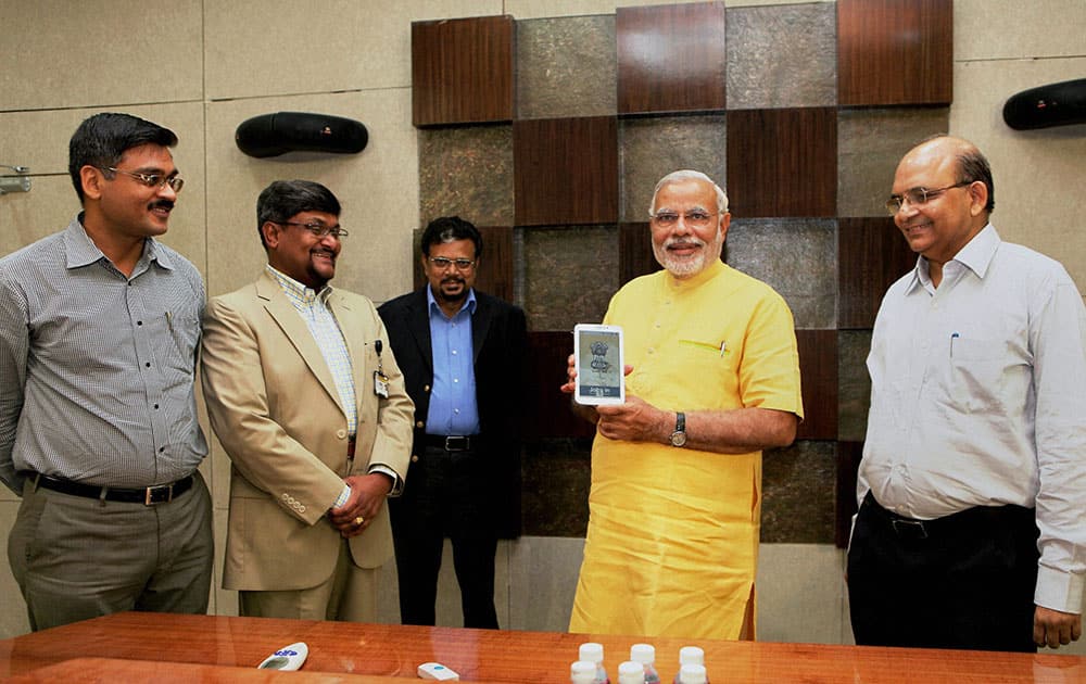 Gujarat Chief Minister Narendra Modi launching a mobile application `JOBS IN` for Government Jobs at Gandhinagar.