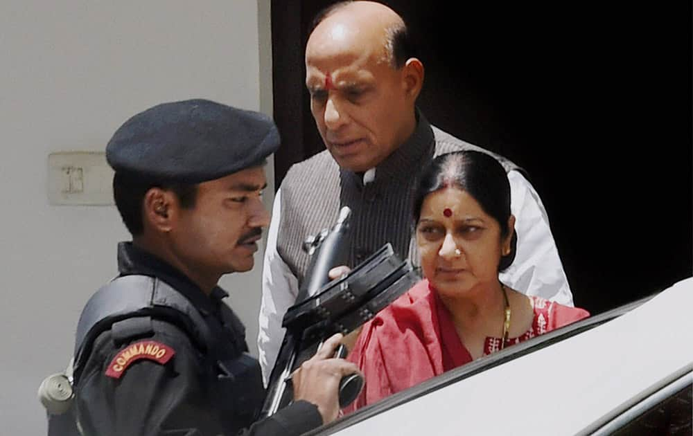 BJP President Rajnath Singh with party leader Sushma Swaraj after a meeting at her residence in New Delhi.