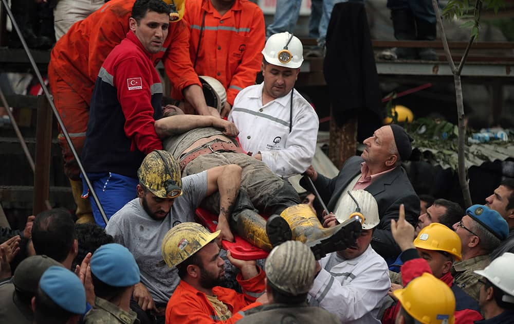 Rescue workers carry a rescued miner from the mine in Soma, western Turkey.