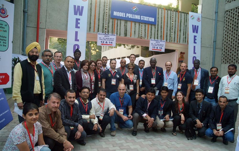 Delegates from eight countries from Africa and the Middle East at a model voting centre in Delhi. [Photo: UNDP India]