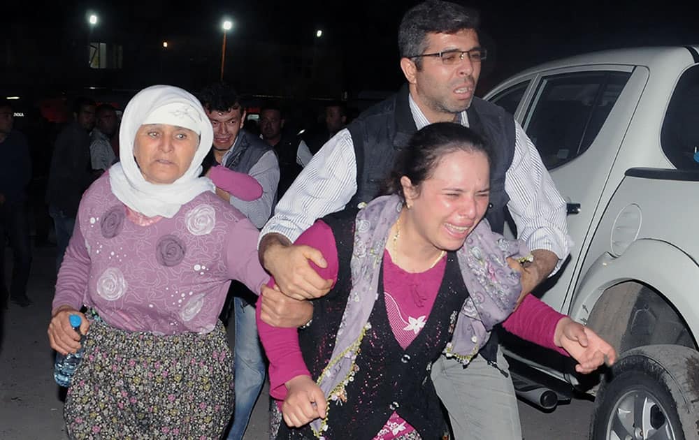 Family members cry as they wait outside a hospital hours after an explosion and fire at a coal mine killed at least 17 miners and left up to 300 workers trapped underground, in Soma, in western Turkey.