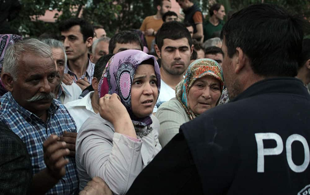 Relatives try to get information outside a local hospital after an explosion and fire at a coal mine in Soma, in western Turkey.