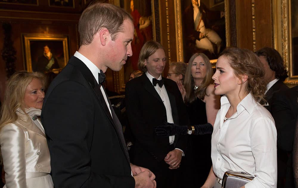 Prince William, Duke of Cambridge, speaks with Emma Watson at a dinner to celebrate the work of The Royal Marsden at Windsor Castle, England.