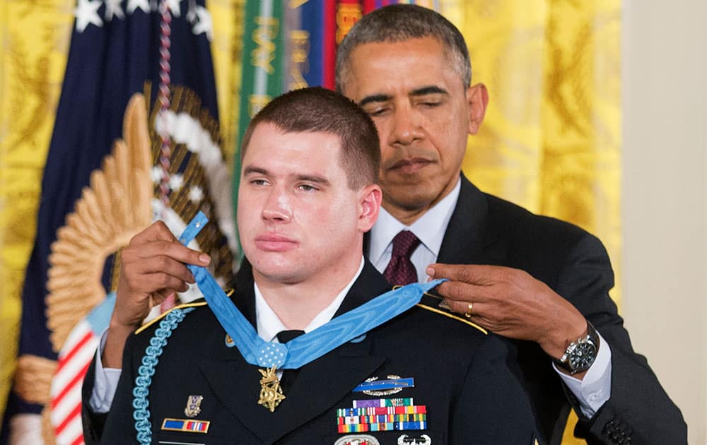 President Barack Obama awards the Medal of Honor to former Army Sgt. Kyle J. White during a ceremony in the East Room of the White House in Washington.