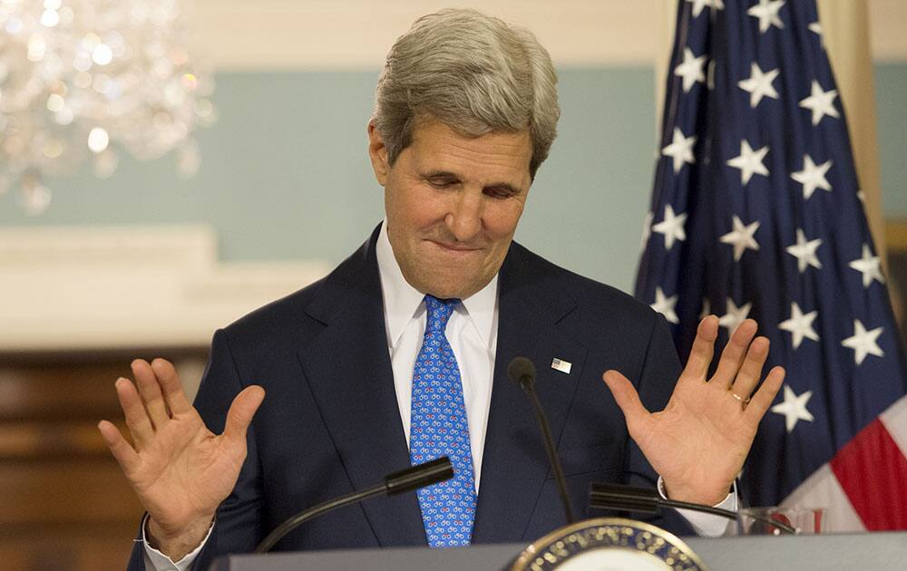 Secretary of State John Kerry reacts to a question during a joint press availability with Italy`s Foreign Minister Federica Mogherini at the State Department in Washington.