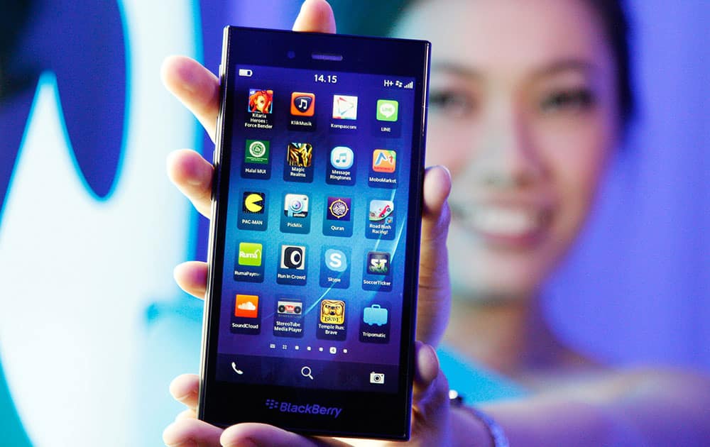 A Blackberry Z3 smartphone is shown by a model during its launch in Jakarta, Indonesia. The Z3 is priced at (US$200) in the country.