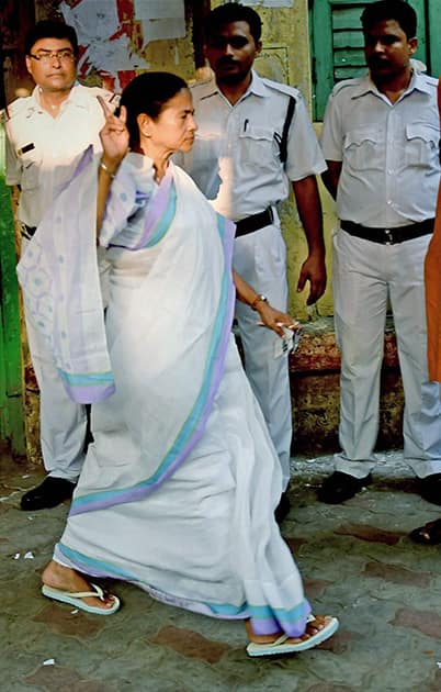 West Bengal Chief Minister and TMC Supremo Mamata Banerjee comes out of a polling booth after casting her vote for Lok Sabha polls in Kolkata.